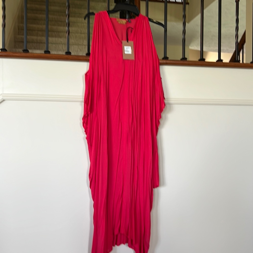 Cold shoulder cocoon dress in a beautiful watermelon color.